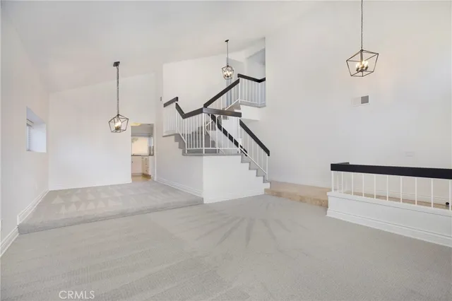 a view of a hallway with stairs