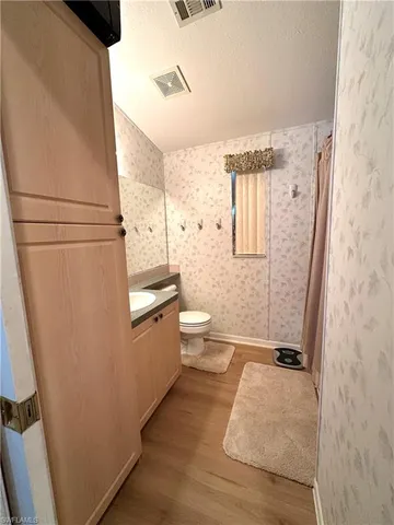 a kitchen with a sink appliances and cabinets