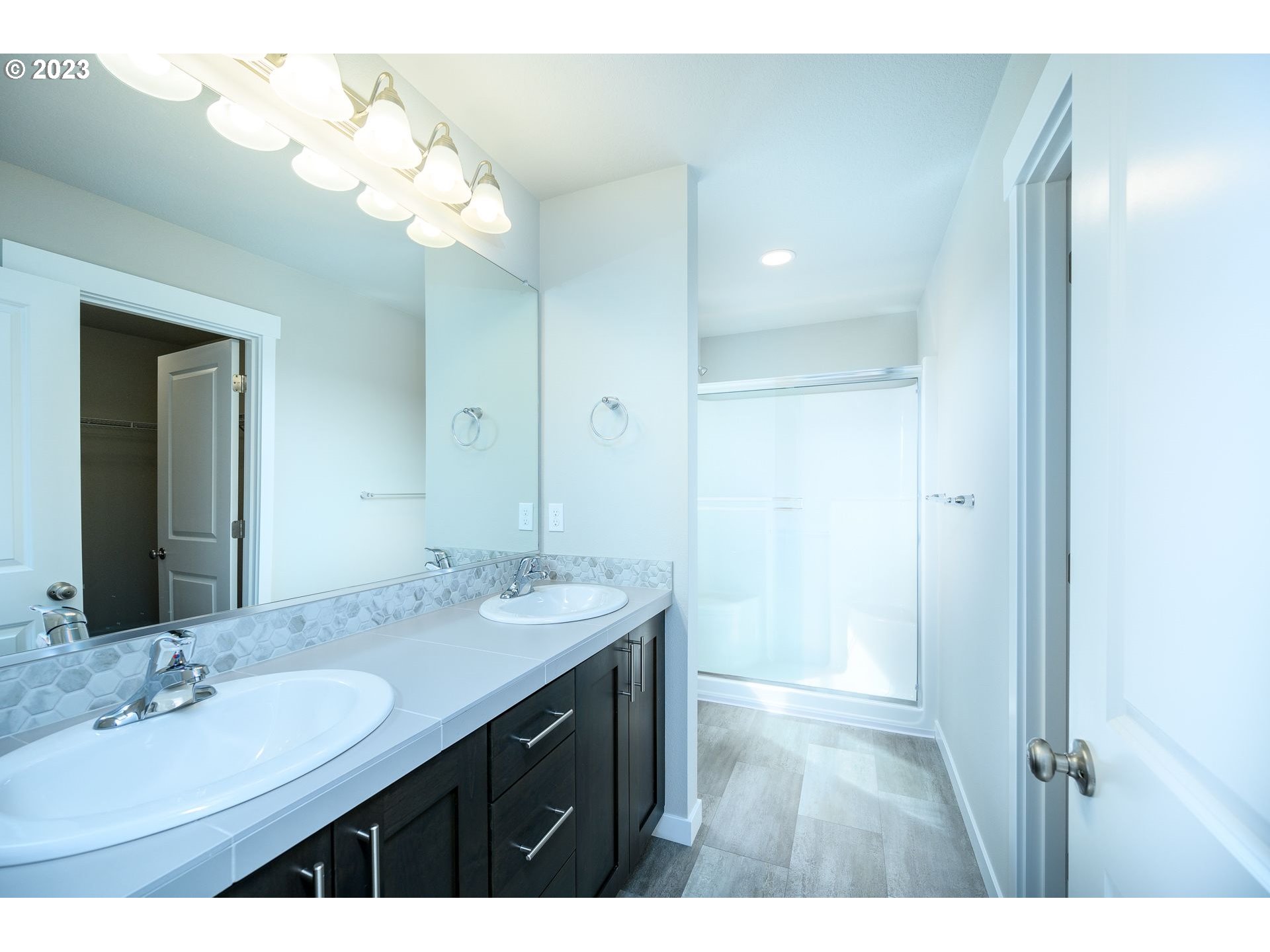 3162 South Magnolia Street, Unit LT754 Cornelius, OR 97113 - Photo 21 of 40 a bathroom with a sink vanity granite and a mirror
