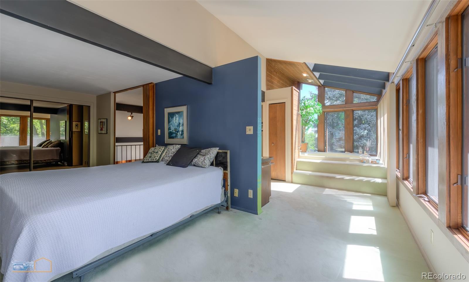 1425 Bellevue Drive Boulder, CO 80302 - Photo 16 of 40 a bed room with a bed and a large window