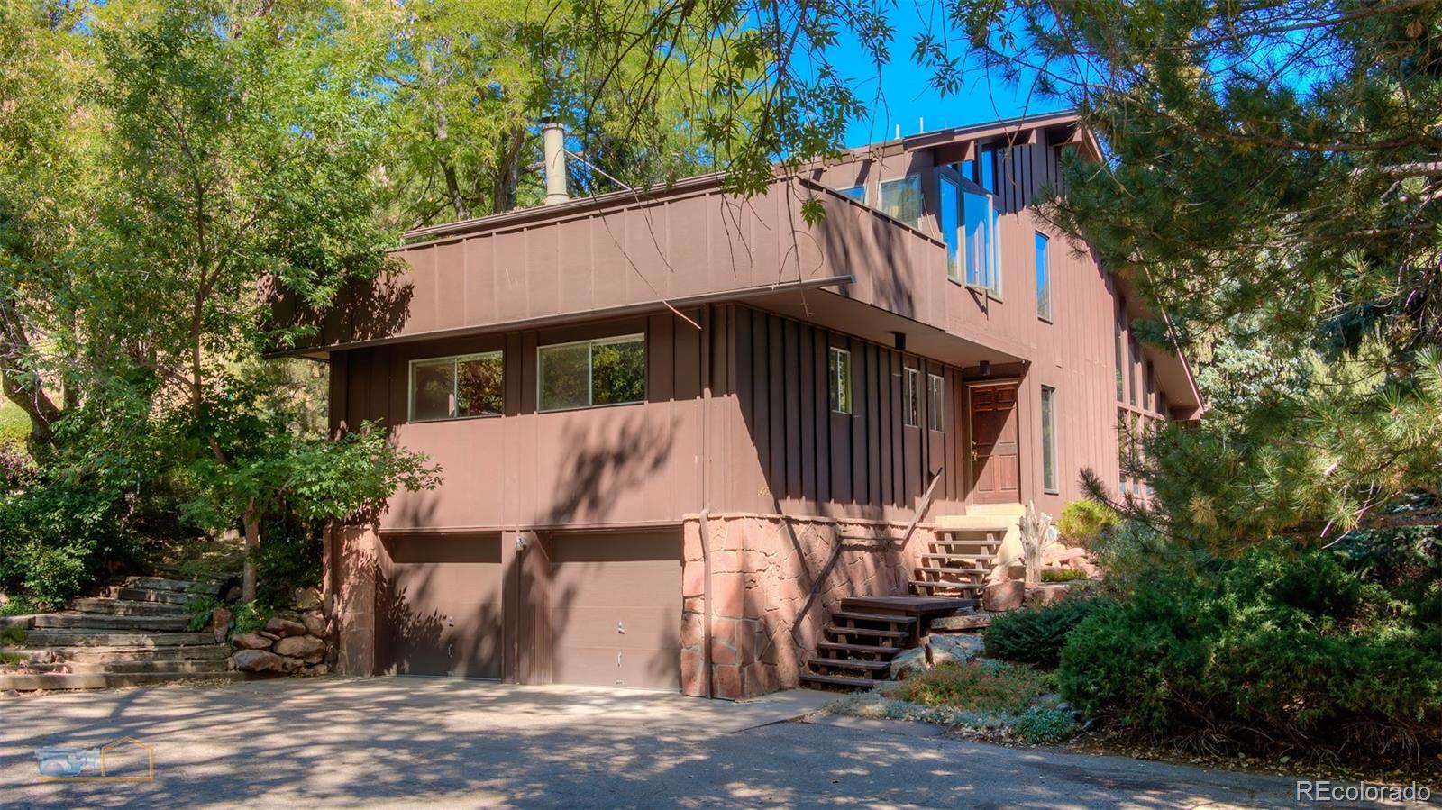 1425 Bellevue Drive Boulder, CO 80302 - Photo 2 of 40 a house with trees in front of it