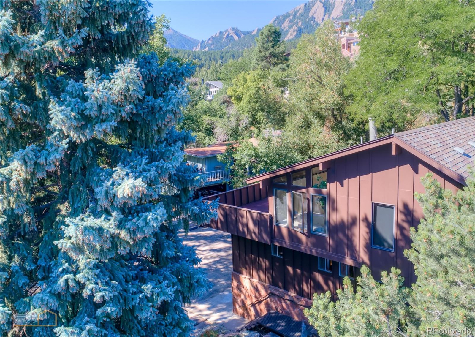 1425 Bellevue Drive Boulder, CO 80302 - Photo 31 of 40 a view of a wooden house with a yard