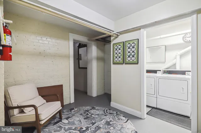 a living room with furniture and a rug