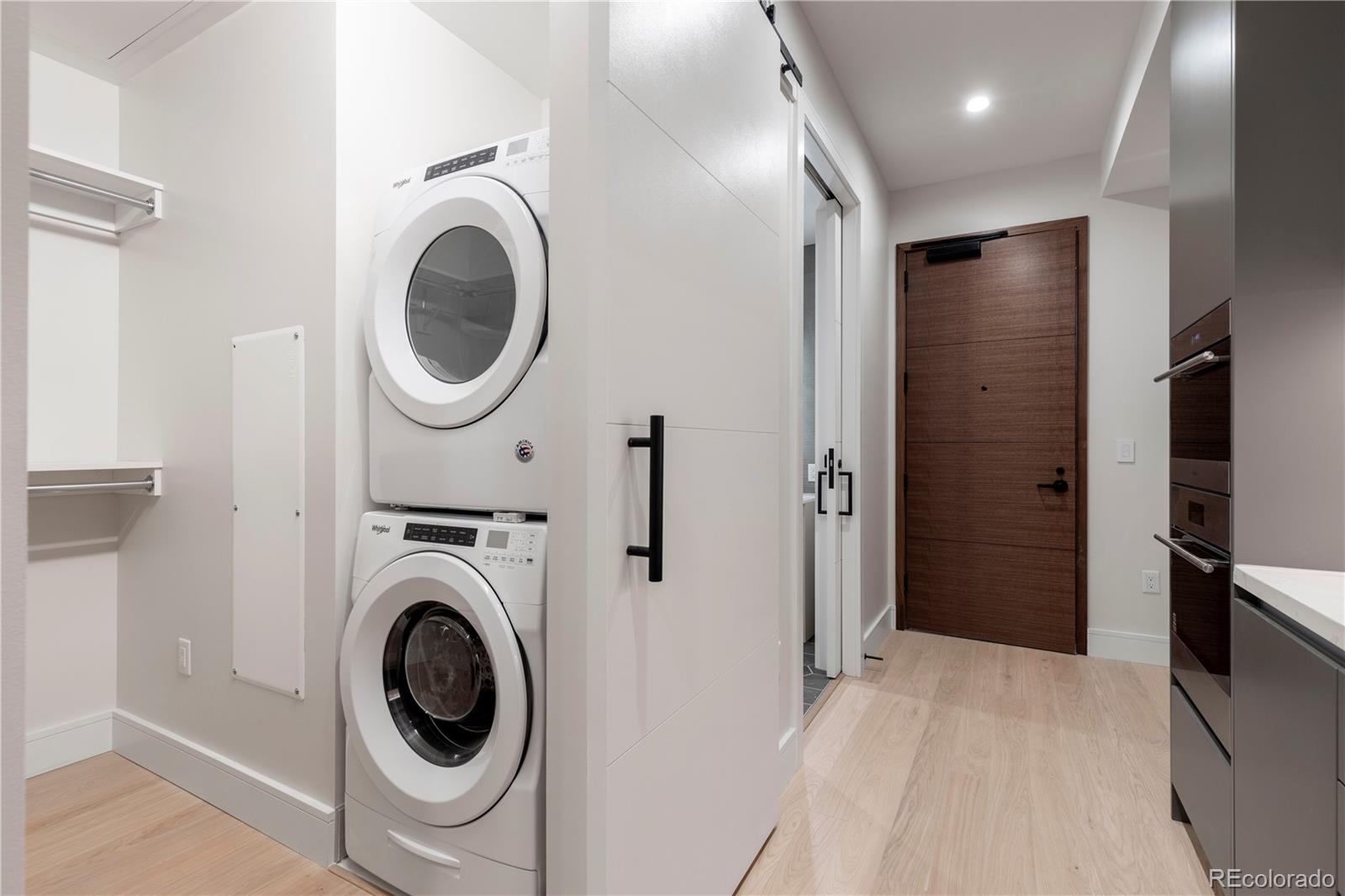 1901 Wazee Street, Unit 311 Denver, CO 80202 - Photo 11 of 17 a view of a hallway with washer and dryer