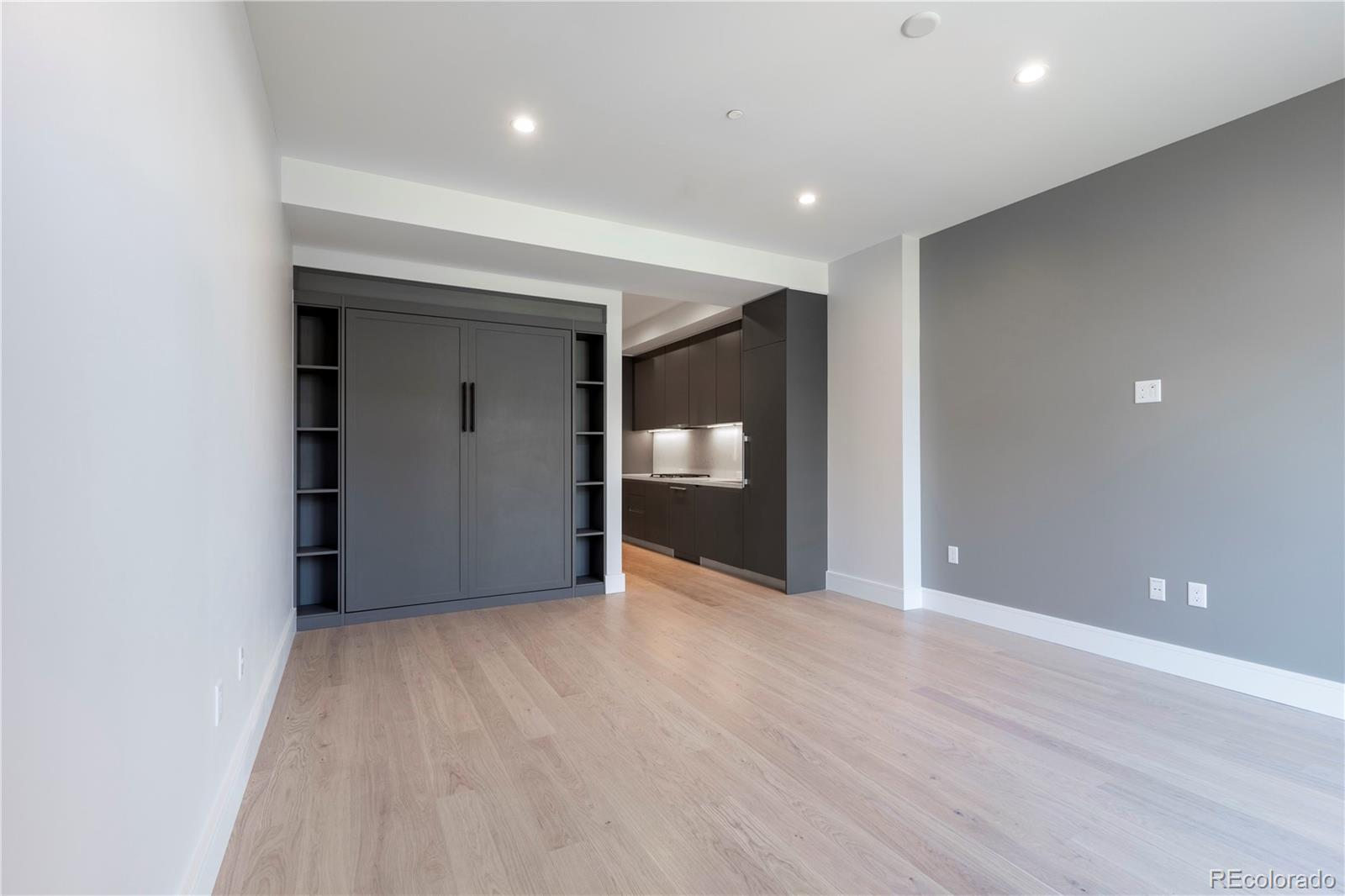 1901 Wazee Street, Unit 311 Denver, CO 80202 - Photo 6 of 17 a view of an empty room with wooden floor