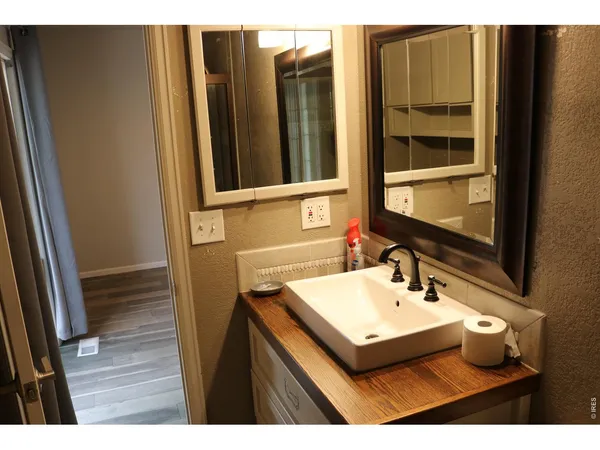 a bathroom with sink and mirror