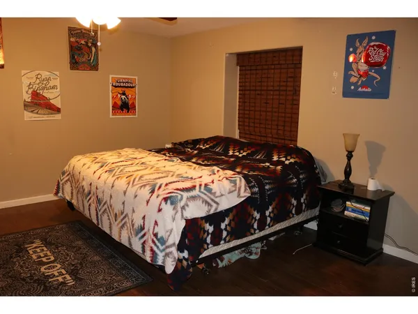 a bed sitting in a bedroom next to a wall