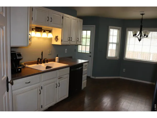 a kitchen with sink and window