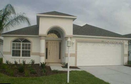 1905 Arbor Knoll Loop Trinity, FL 34655 - Photo 1 of 1 a front view of a house with a garden