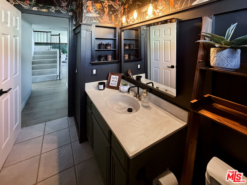 824 Cooper Drive Lompoc, CA 93436 - Photo 14 of 24 a bathroom with a sink vanity and a mirror