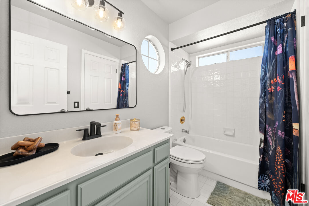 824 Cooper Drive Lompoc, CA 93436 - Photo 17 of 24 a bathroom with a sink a toilet and a mirror