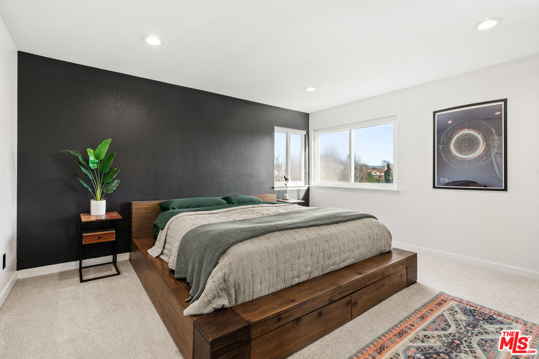 824 Cooper Drive Lompoc, CA 93436 - Photo 18 of 24 a bedroom with a bed and a potted plant