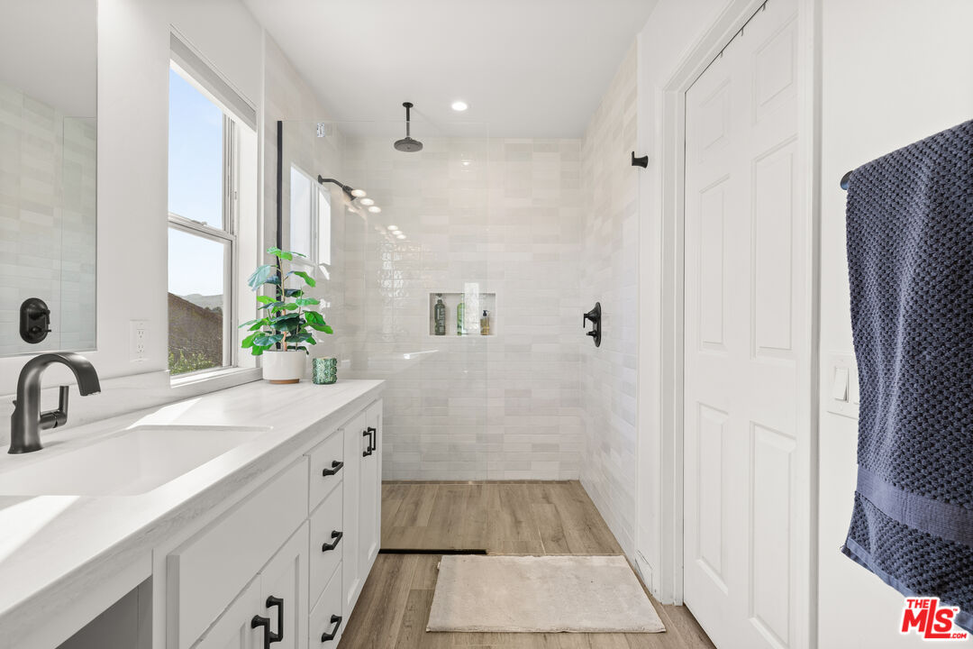 824 Cooper Drive Lompoc, CA 93436 - Photo 19 of 24 a bathroom with a sink and a mirror