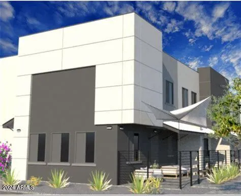 a view of two chairs and a table in the patio