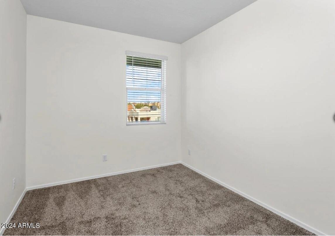 16520 North Greasewood Street, Unit 3 Surprise, AZ 85378 - Photo 11 of 16 an empty room with a window