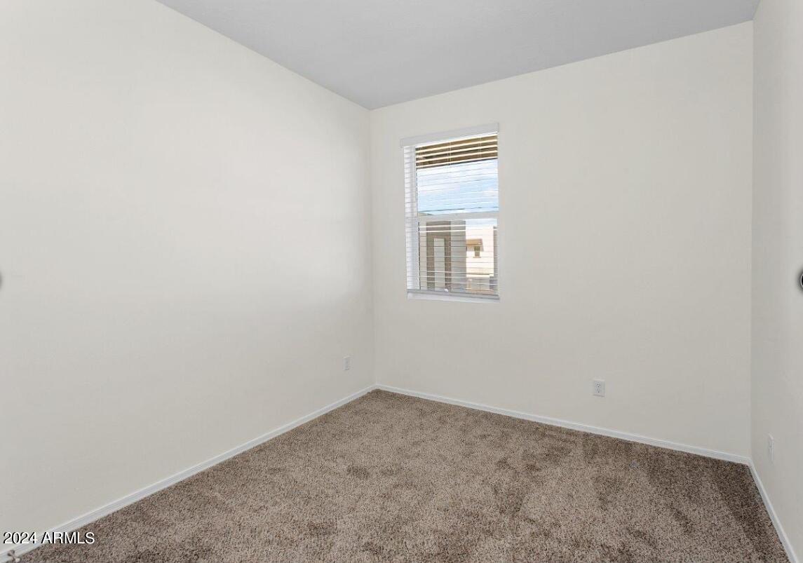 16520 North Greasewood Street, Unit 3 Surprise, AZ 85378 - Photo 12 of 16 an empty room with a window