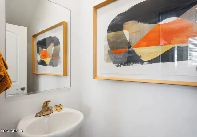 a bathroom with a sink and mirror