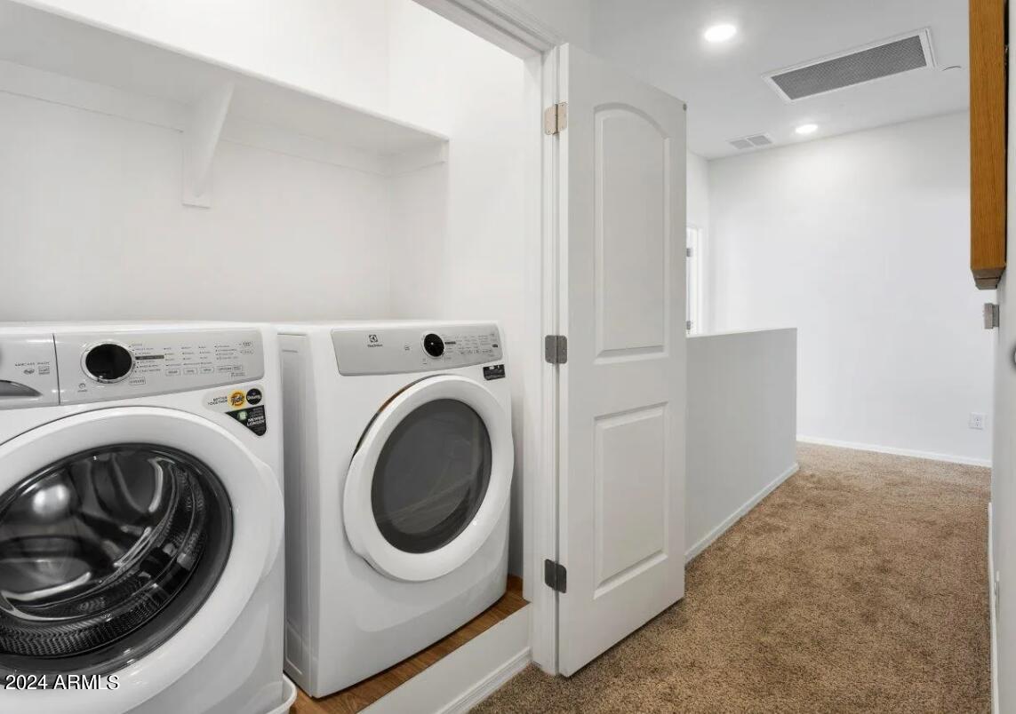 16520 North Greasewood Street, Unit 3 Surprise, AZ 85378 - Photo 15 of 16 a view of a storage & utility room with washer and dryer