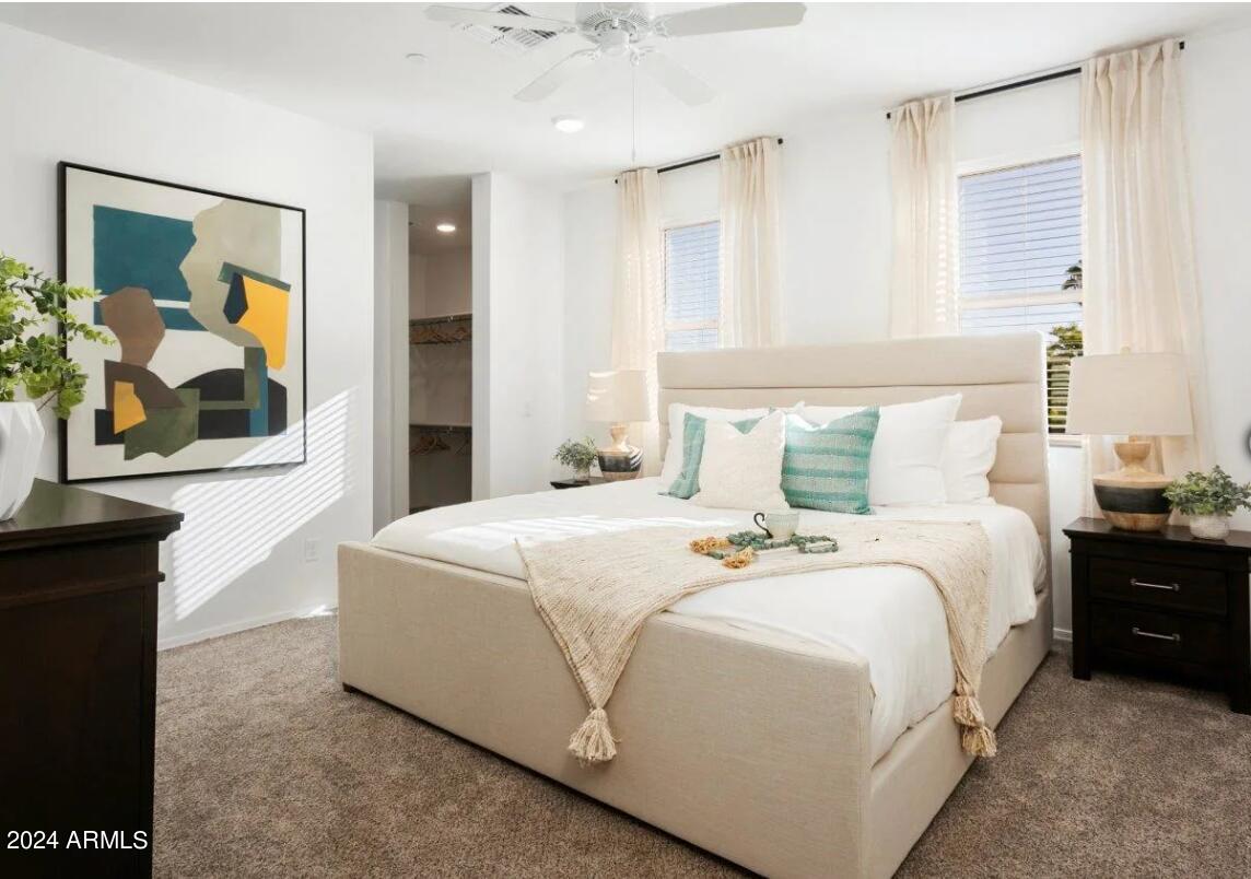 16520 North Greasewood Street, Unit 3 Surprise, AZ 85378 - Photo 7 of 16 a bedroom with a bed and a painting on the wall