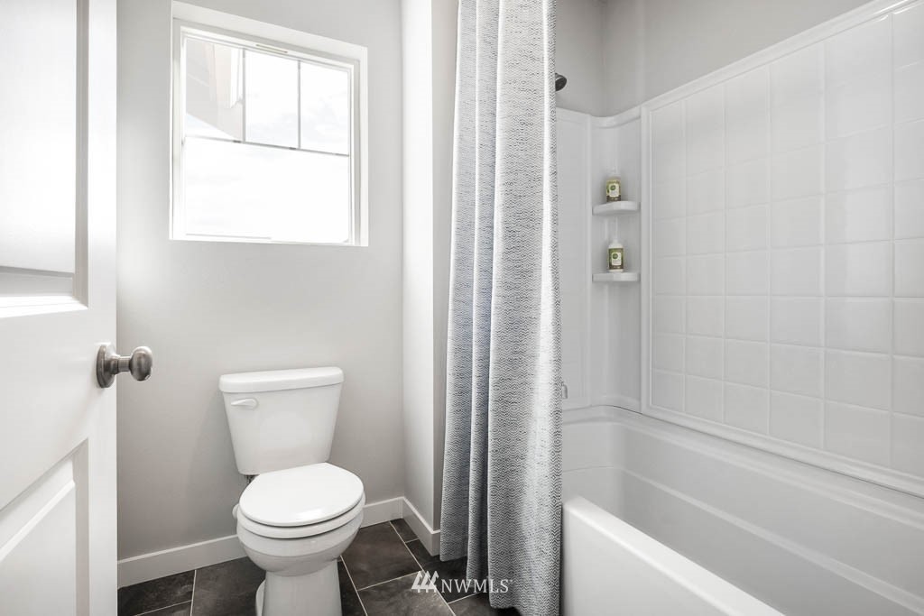 26 180th Place Southwest, Unit 25 Bothell, WA 98012 - Photo 21 of 39 a bathroom with a toilet sink and shower
