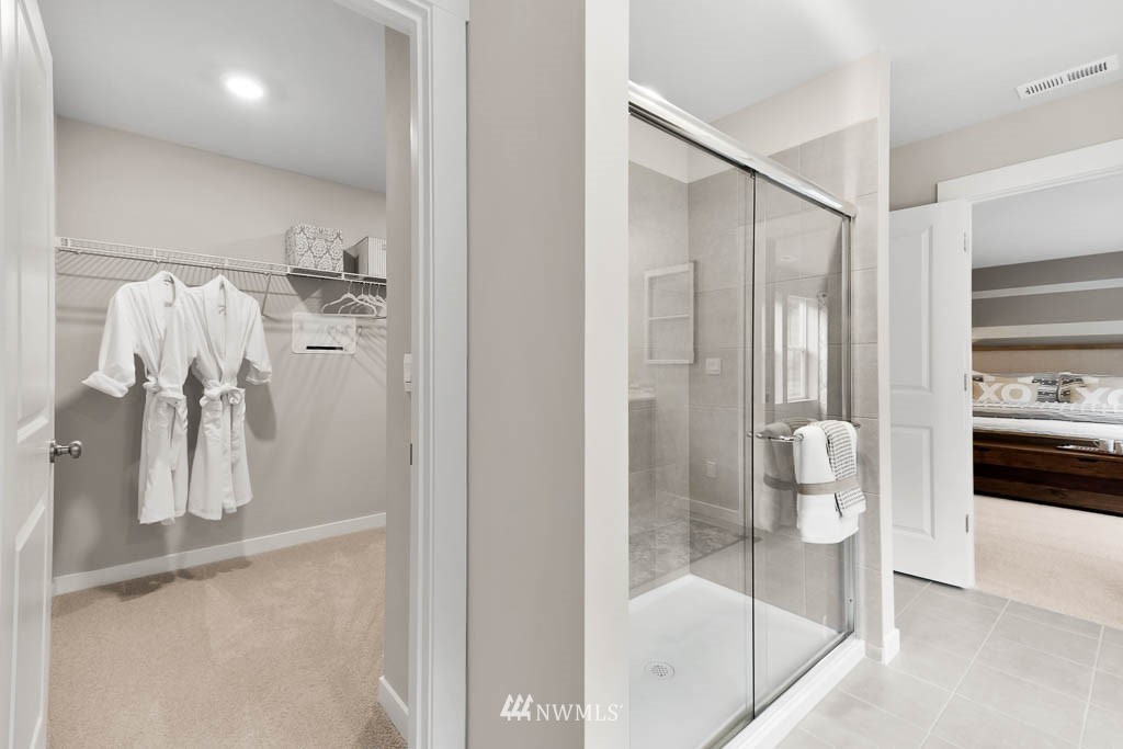 26 180th Place Southwest, Unit 25 Bothell, WA 98012 - Photo 37 of 39 a bathroom with a glass shower door and a sink