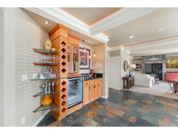 a living room with stainless steel appliances kitchen island granite countertop furniture and a kitchen view