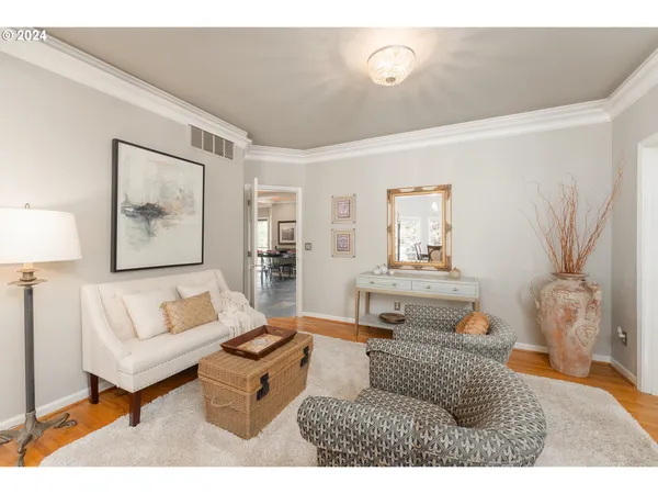 a living room with furniture and a lamp