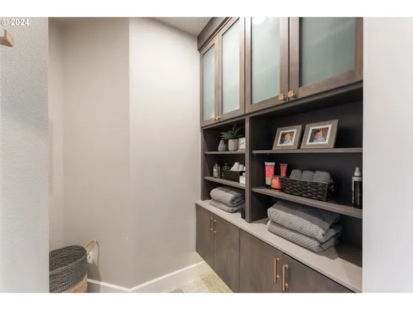 a kitchen view with wooden floor and cabinets
