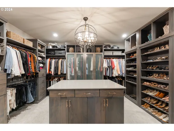 a view of a livingroom with furniture and staircase