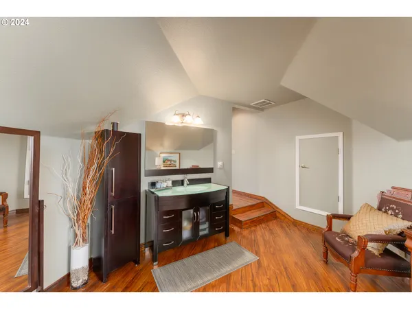 a open kitchen with stainless steel appliances granite countertop a refrigerator a stove and a sink