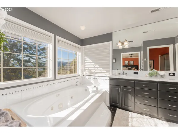 a bathroom with a bathtub and a sink