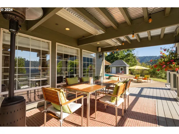 a view of a patio with table and chairs and potted plants
