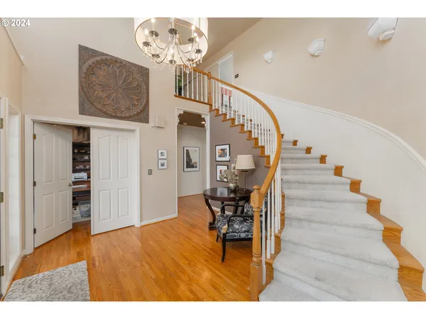 a view of entryway dining room and hall with wooden floor