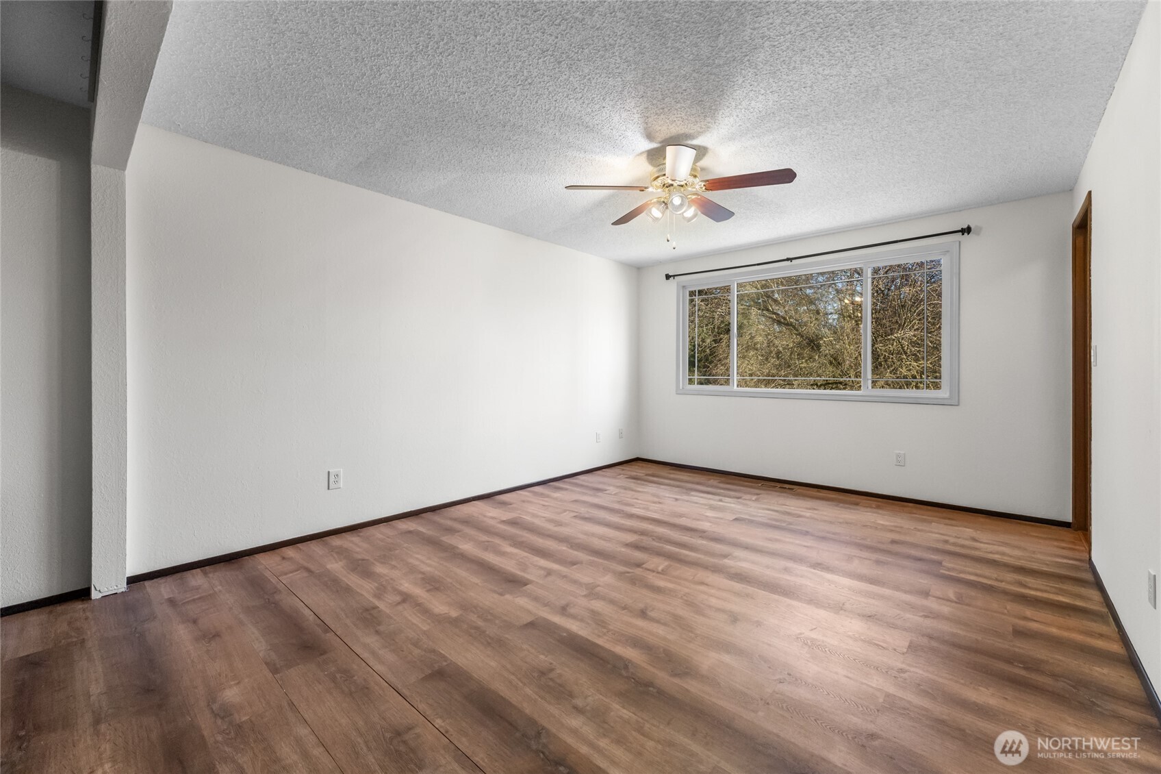 25847 185th Place Southeast Covington, WA 98042 - Photo 13 of 17 a view of empty room with wooden floor and fan
