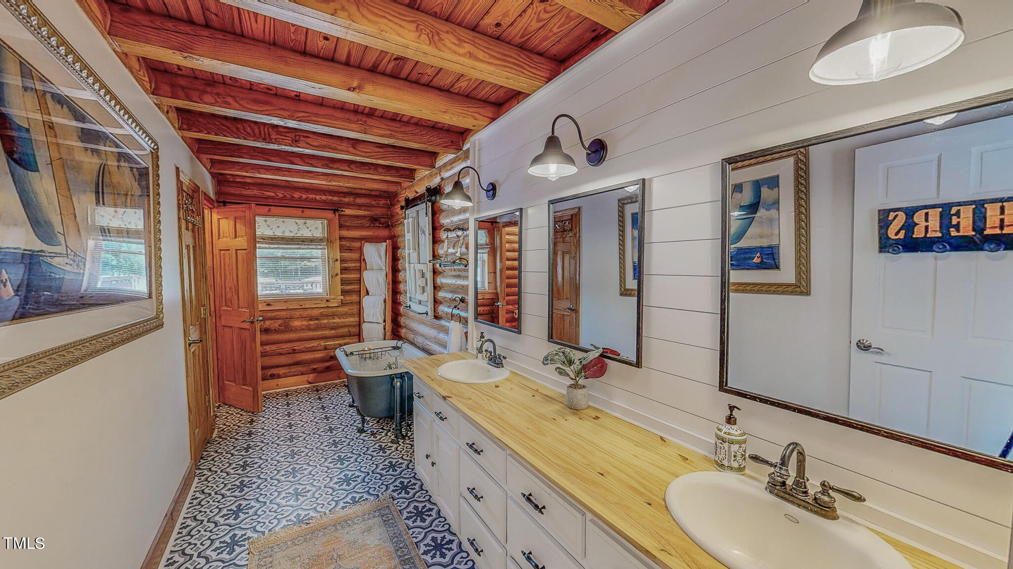 9529 Hester Road Hurdle Mills, NC 27541 - Photo 18 of 85 a bathroom with a double vanity sink toilet and a large mirror