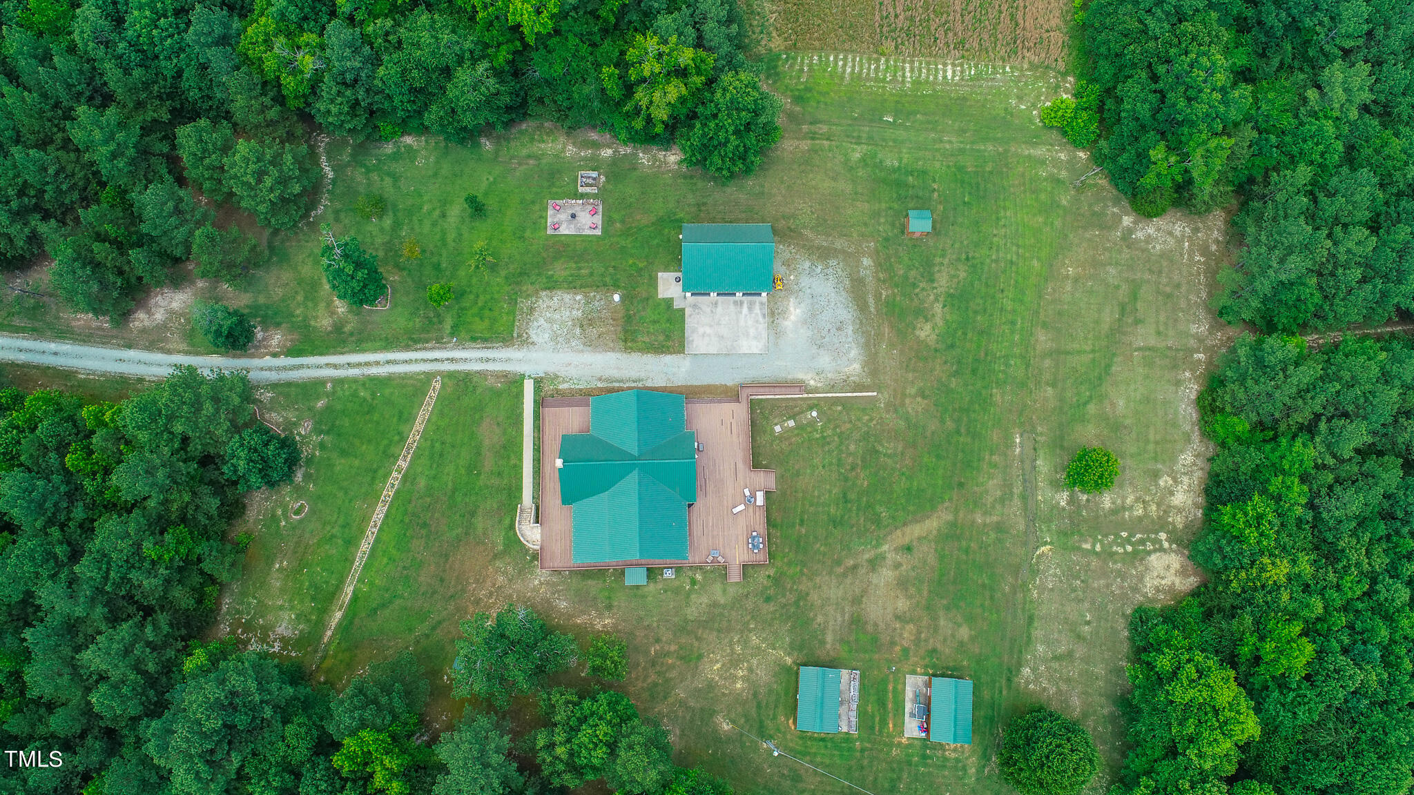 9529 Hester Road Hurdle Mills, NC 27541 - Photo 27 of 85 a green field with lots of palm trees