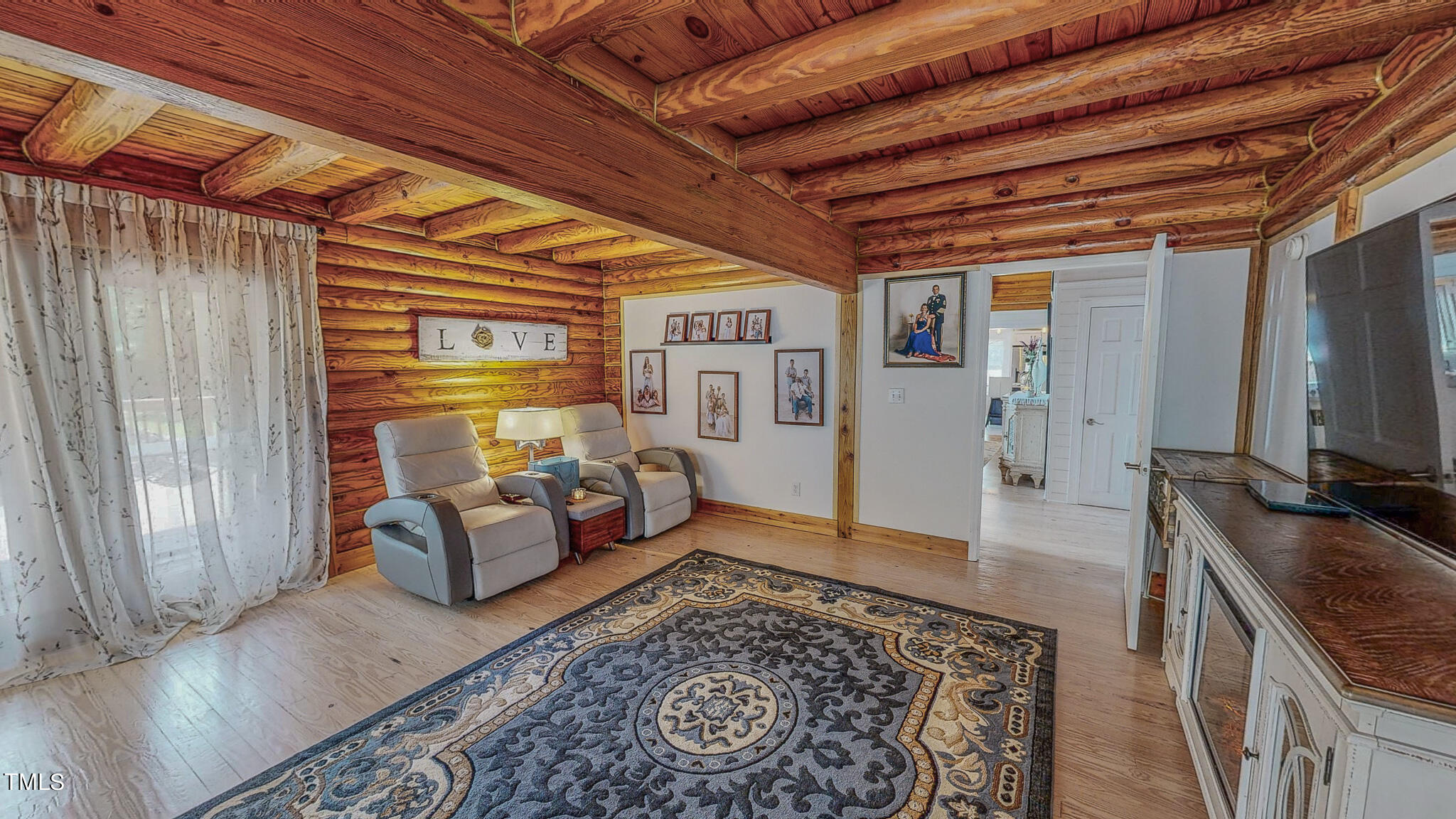9529 Hester Road Hurdle Mills, NC 27541 - Photo 31 of 85 a living room with furniture and a flat screen tv