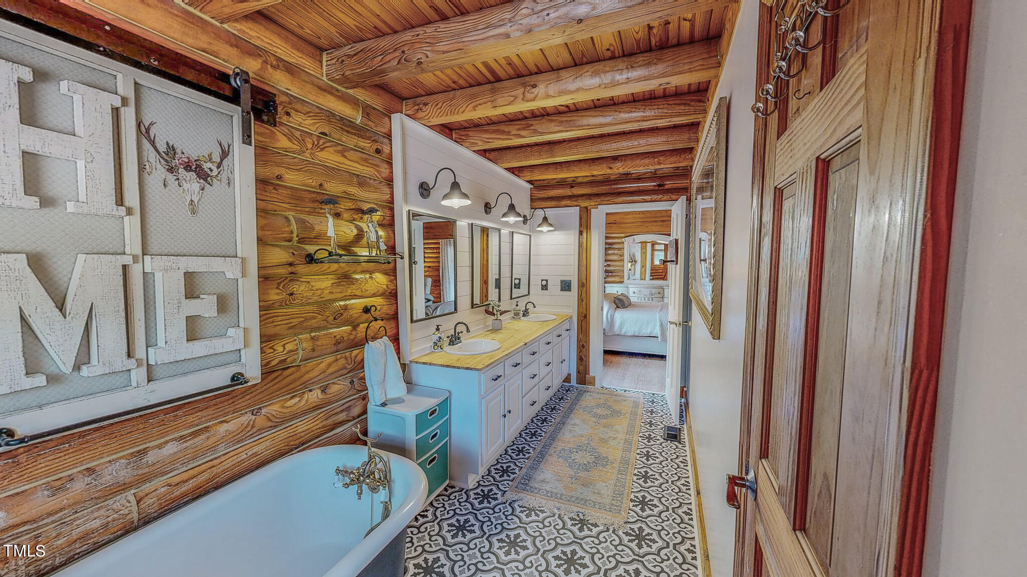 9529 Hester Road Hurdle Mills, NC 27541 - Photo 34 of 85 a spacious bathroom with a tub shower and mirror