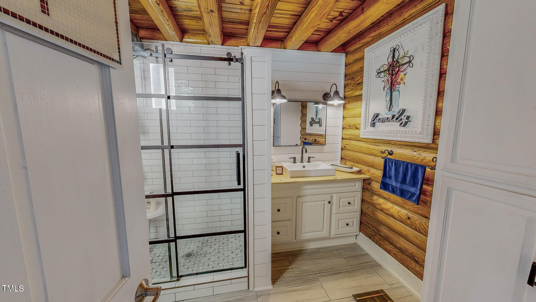 9529 Hester Road Hurdle Mills, NC 27541 - Photo 46 of 85 a bathroom with a shower and a sink