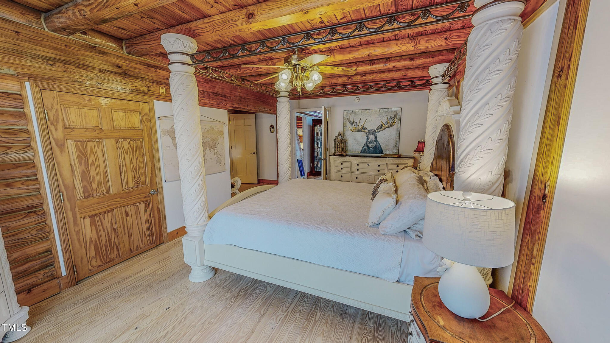 9529 Hester Road Hurdle Mills, NC 27541 - Photo 53 of 85 a bedroom with a bed and wooden floor