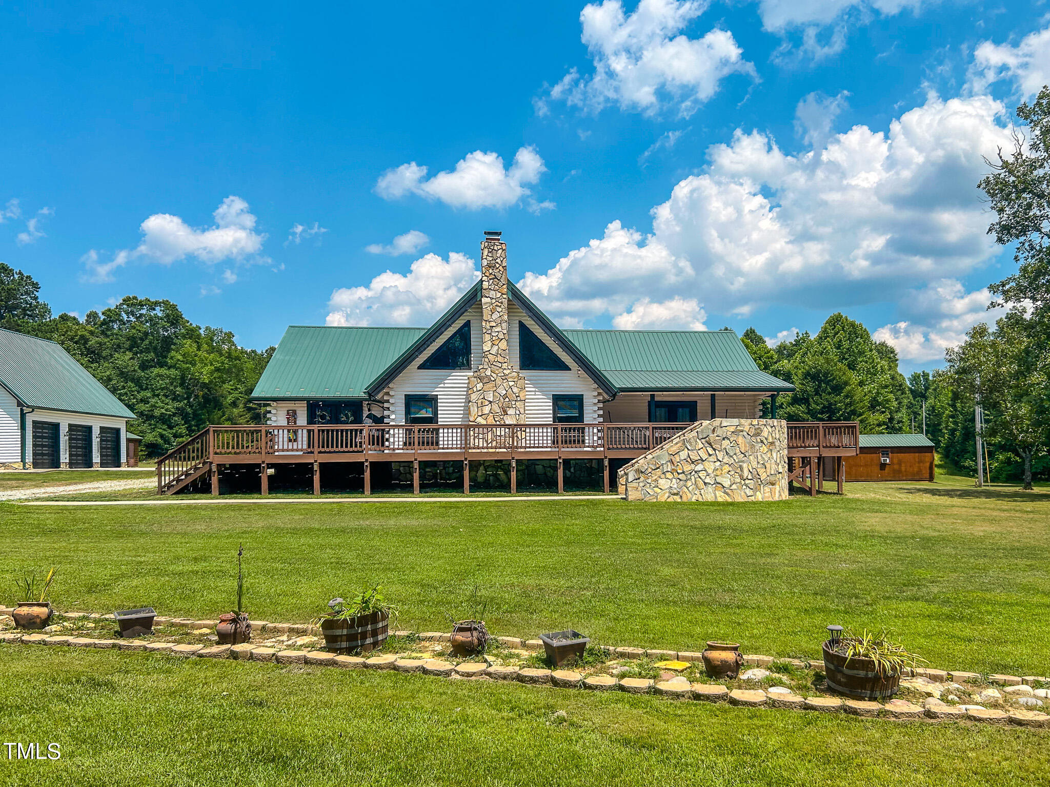 9529 Hester Road Hurdle Mills, NC 27541 - Photo 57 of 85 a view of a house with a big yard