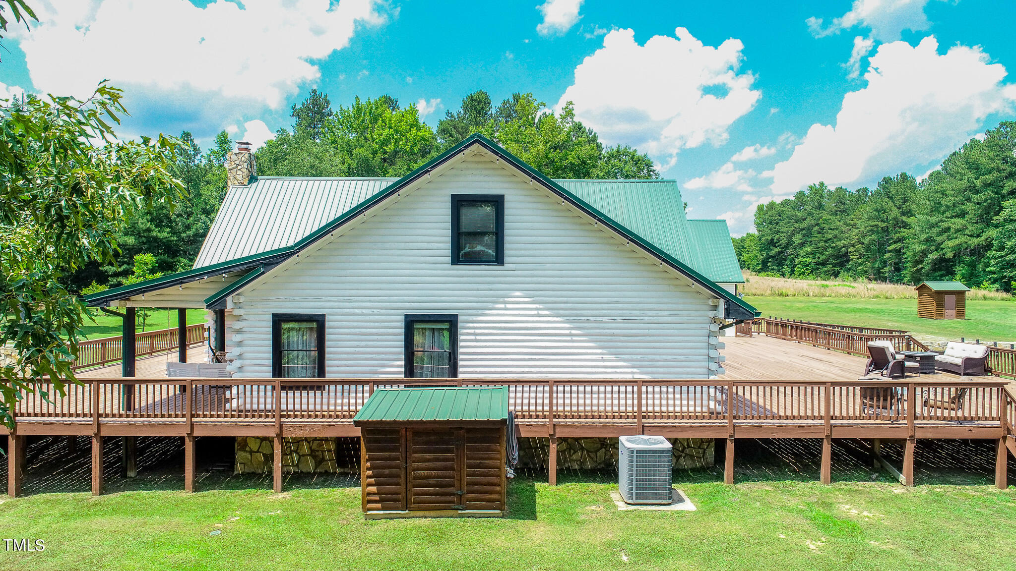 9529 Hester Road Hurdle Mills, NC 27541 - Photo 67 of 85 a view of a house with a yard and sitting area