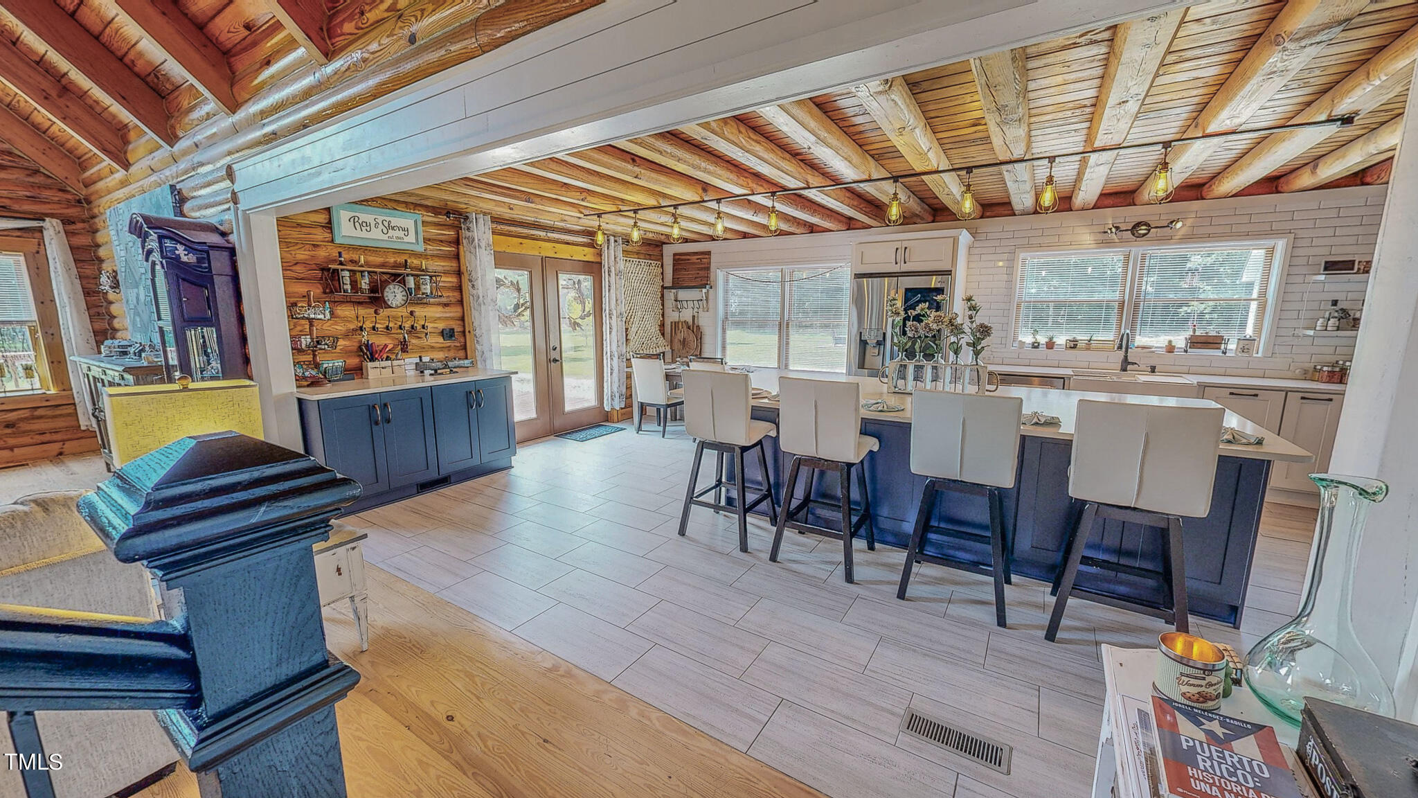 9529 Hester Road Hurdle Mills, NC 27541 - Photo 69 of 85 a view of a dining room with furniture window and wooden floor