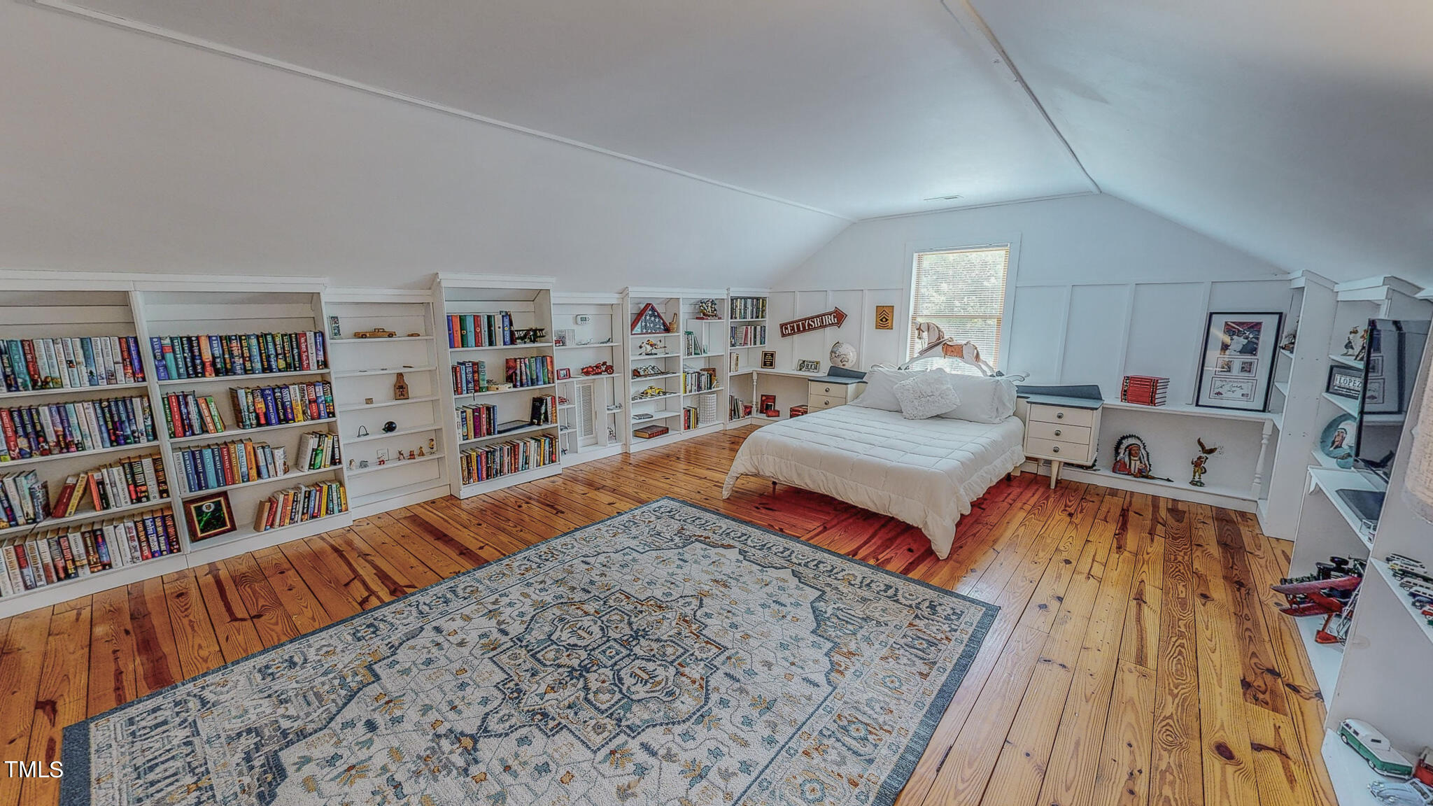9529 Hester Road Hurdle Mills, NC 27541 - Photo 71 of 85 a bedroom with a bed and a book shelf
