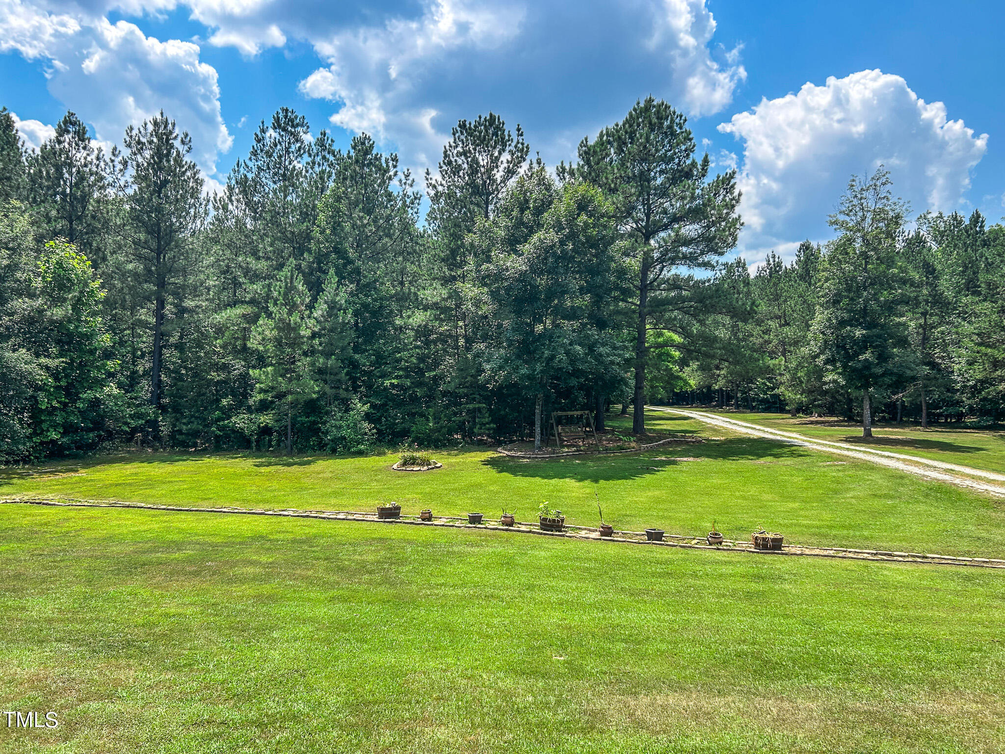 9529 Hester Road Hurdle Mills, NC 27541 - Photo 84 of 85 a view of a golf course with a swimming pool
