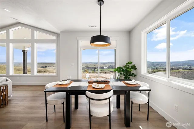 a view of a dining room with furniture window and outside view