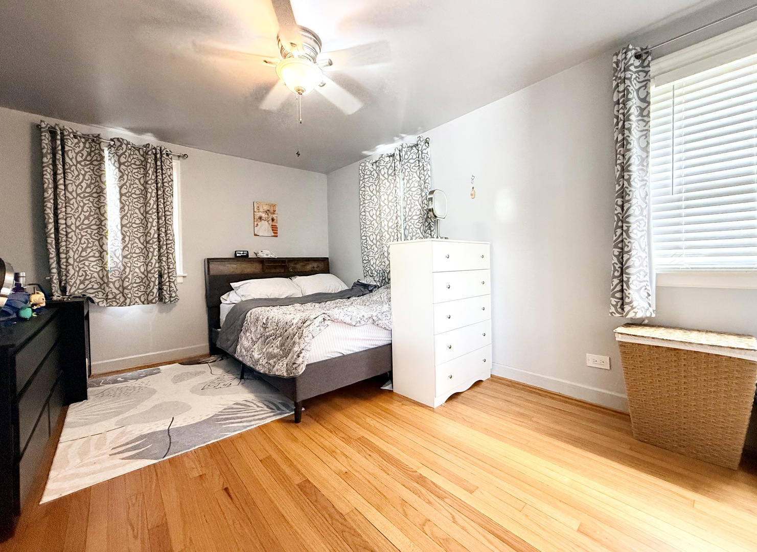 416 North Main Street Mount Prospect, IL 60056 - Photo 11 of 24 a bedroom with a large bed and a chandelier