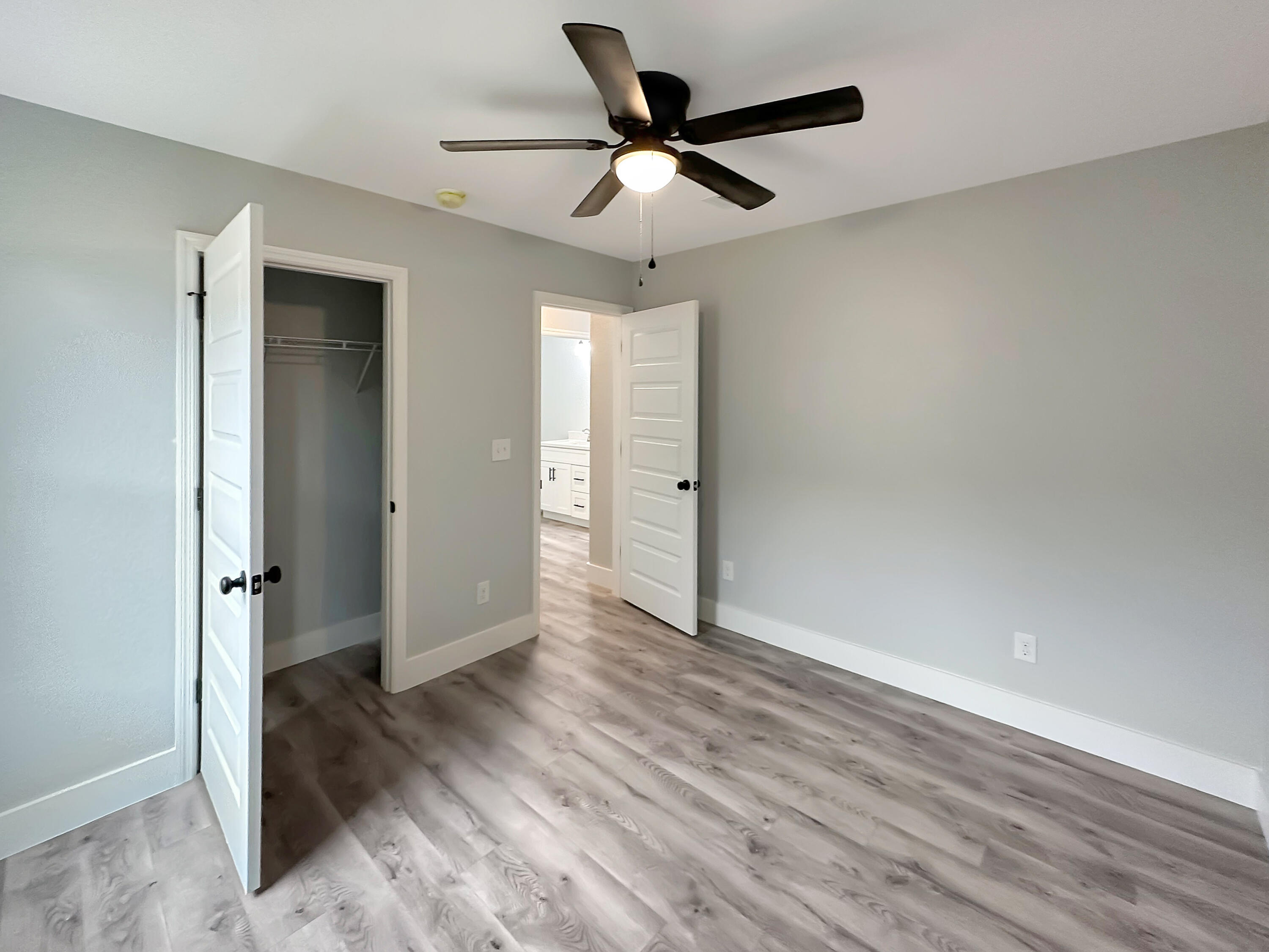 5771 Monroe Street Baker, FL 32531 - Photo 14 of 23 a view of empty room with wooden floor