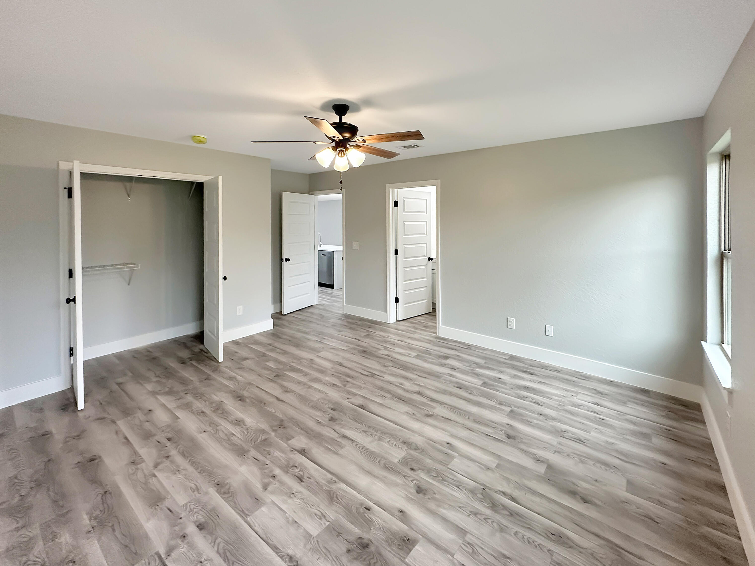 5771 Monroe Street Baker, FL 32531 - Photo 18 of 23 wooden floor in an empty room with a window
