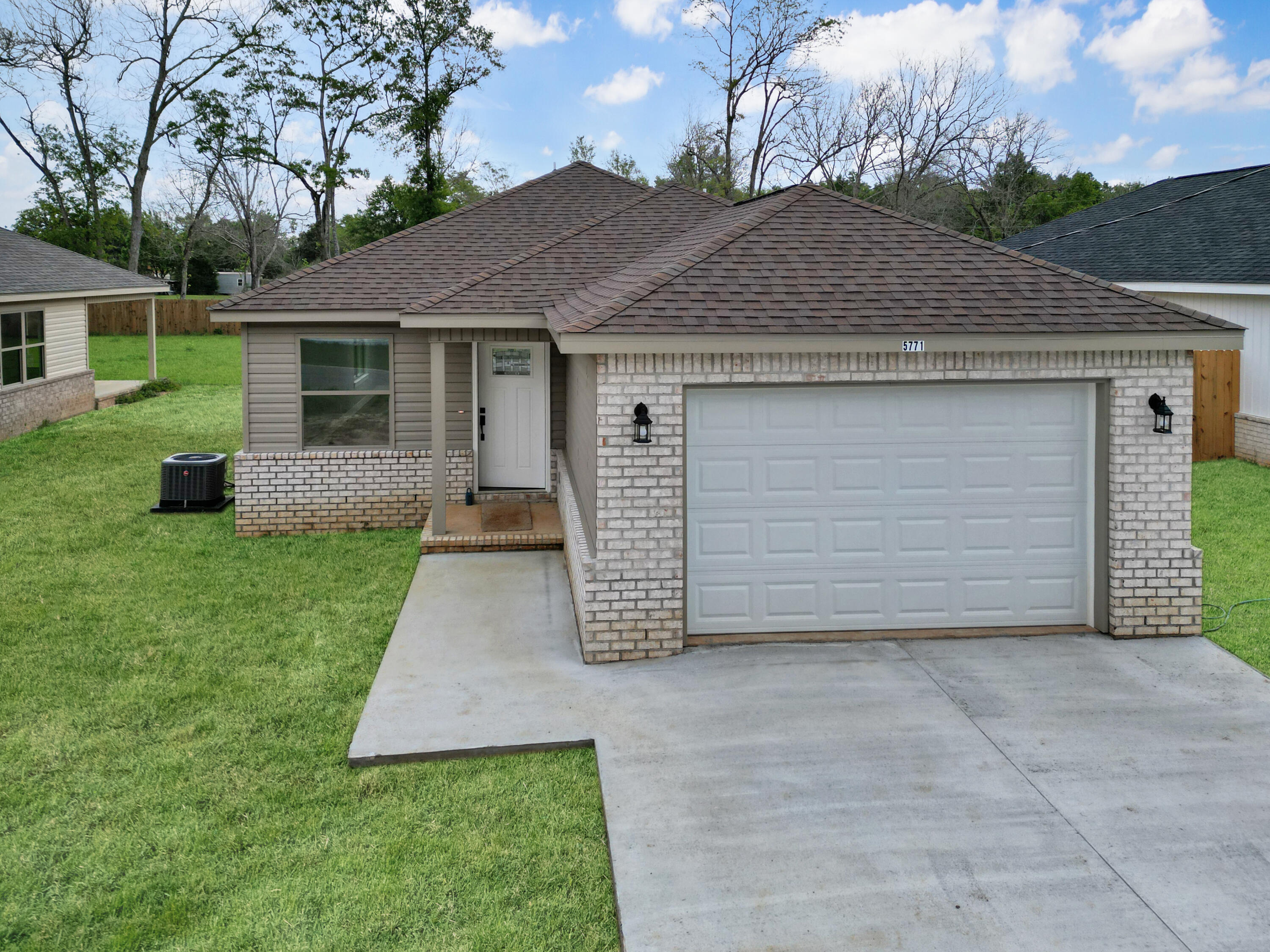 5771 Monroe Street Baker, FL 32531 - Photo 21 of 23 a front view of house with yard
